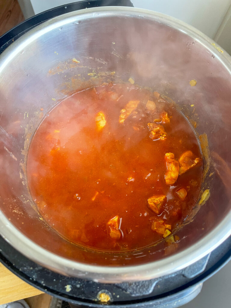 Simmering chicken tikka masala