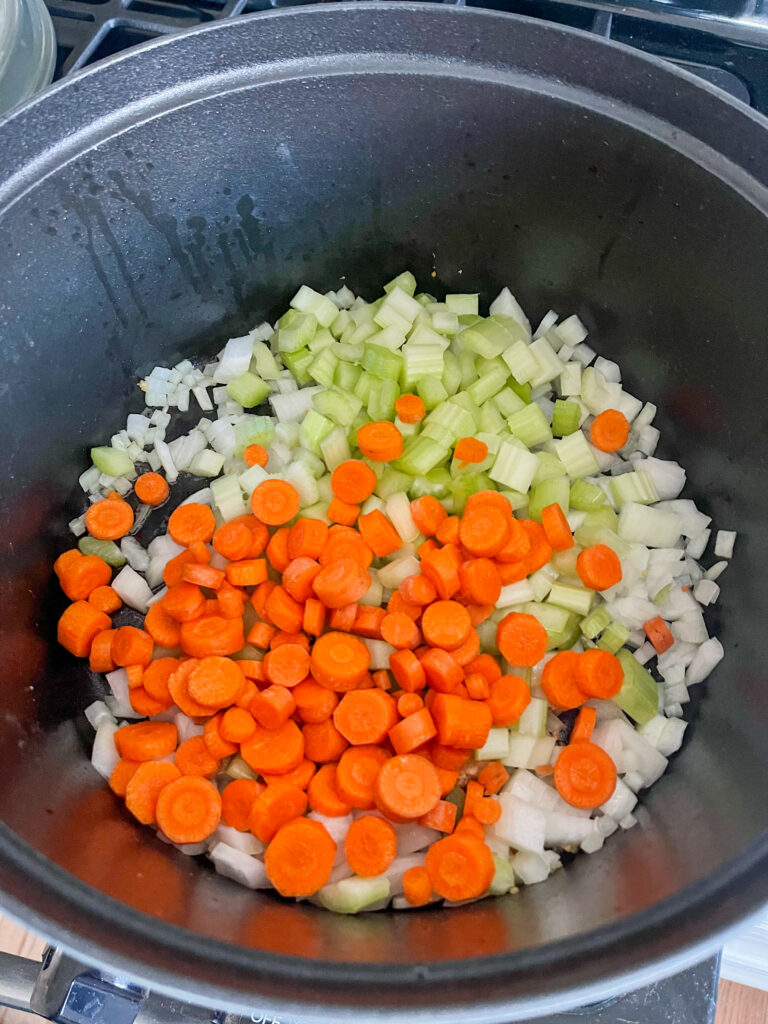 Carrots onions and celery in pot