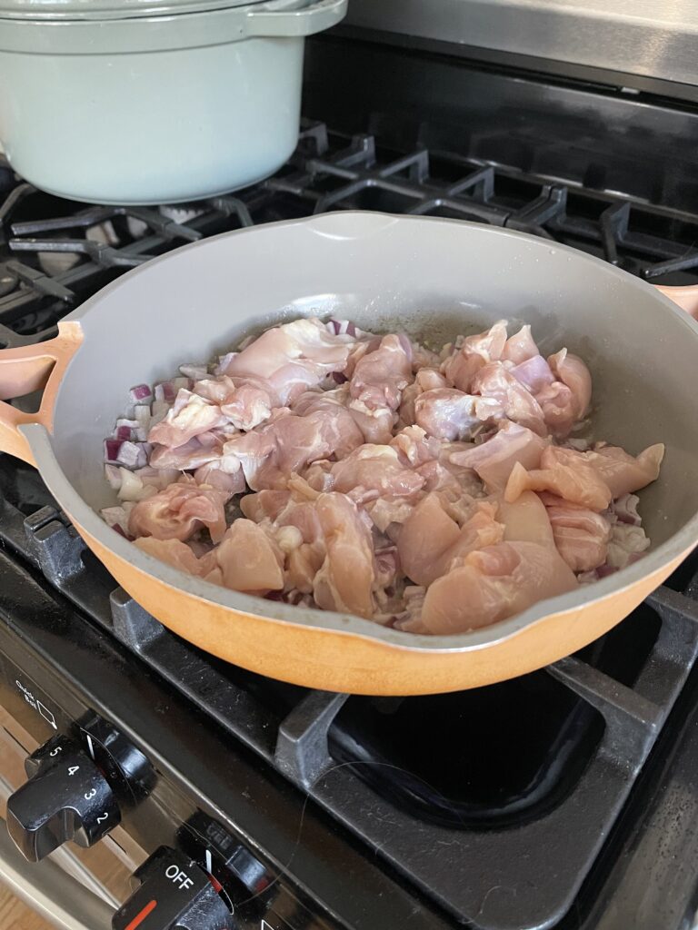 Chicken cooking in skillet